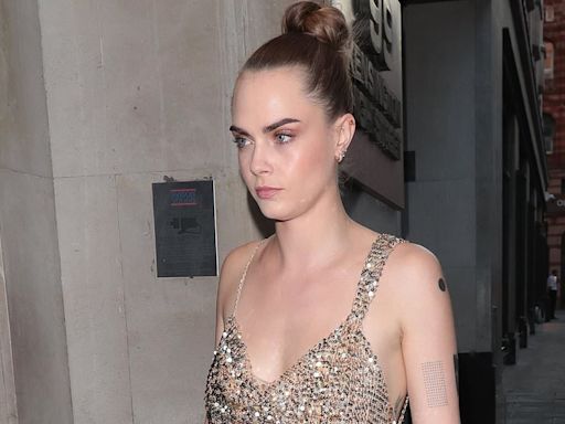 Cara Delevingne joins sister Poppy at their prosecco brand's party