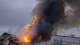 Fire destroys Copenhagen's Old Stock Exchange dating to 1600s, collapsing its dragon-tail spire