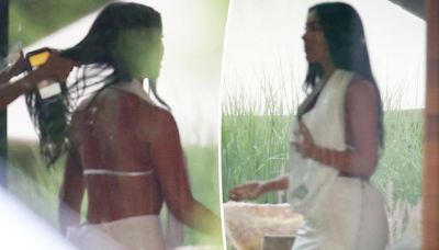 Kim Kardashian stuns in halter top and matching skirt at Michael Rubin’s Fourth of July white party in the Hamptons