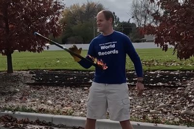 Man spins fire sword 73 times in 30 seconds, captures 166th world record