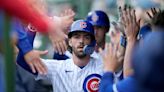 Swanson and Candelario go deep as the Cubs hold off the Braves 8-6 at rainy Wrigley