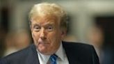 Former US President Donald Trump speaks to the press at the end of the day of his trial for allegedly covering up hush money payments linked to extramarital affairs, at Manhattan Criminal Court in...