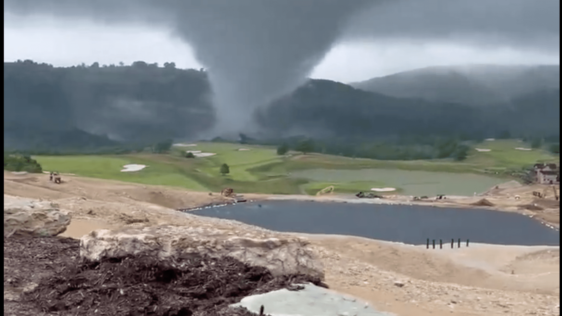 Watch huge tornado rip through Tiger Woods golf course as daredevils risk lives