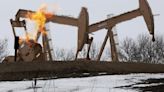 Oil prices settle lower as spike in US crude stockpiles dent tight supply bets