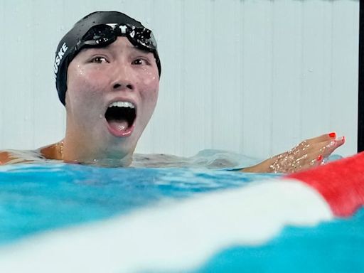 Video: U.S. swimmer invites teammate to top of the podium after winning gold