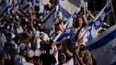 Israeli nationalists march in Jerusalem as a far-right minister boasts of Jewish prayer at key site