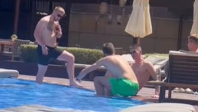 Scott McTominay relaxes by a pool in Ibiza with Michael Carrick