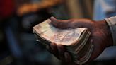 Rupee to run into dollar strength after unexpected rally