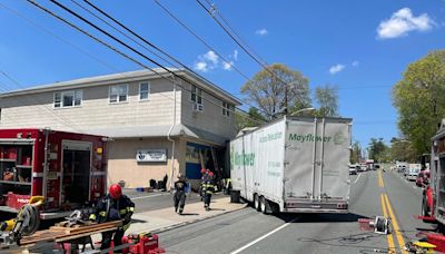 Tractor-trailer crash shuts down Route 23 in Cedar Grove, damages building, 2 hospitalized