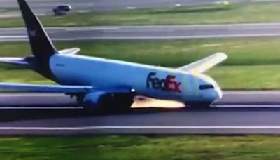 Terrifying moment Boeing plane nosedives on runway and sends sparks flying