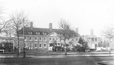 Looking back at a former hospital and its original entrance