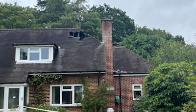 Gaping hole in bungalow roof after being hit by lightning