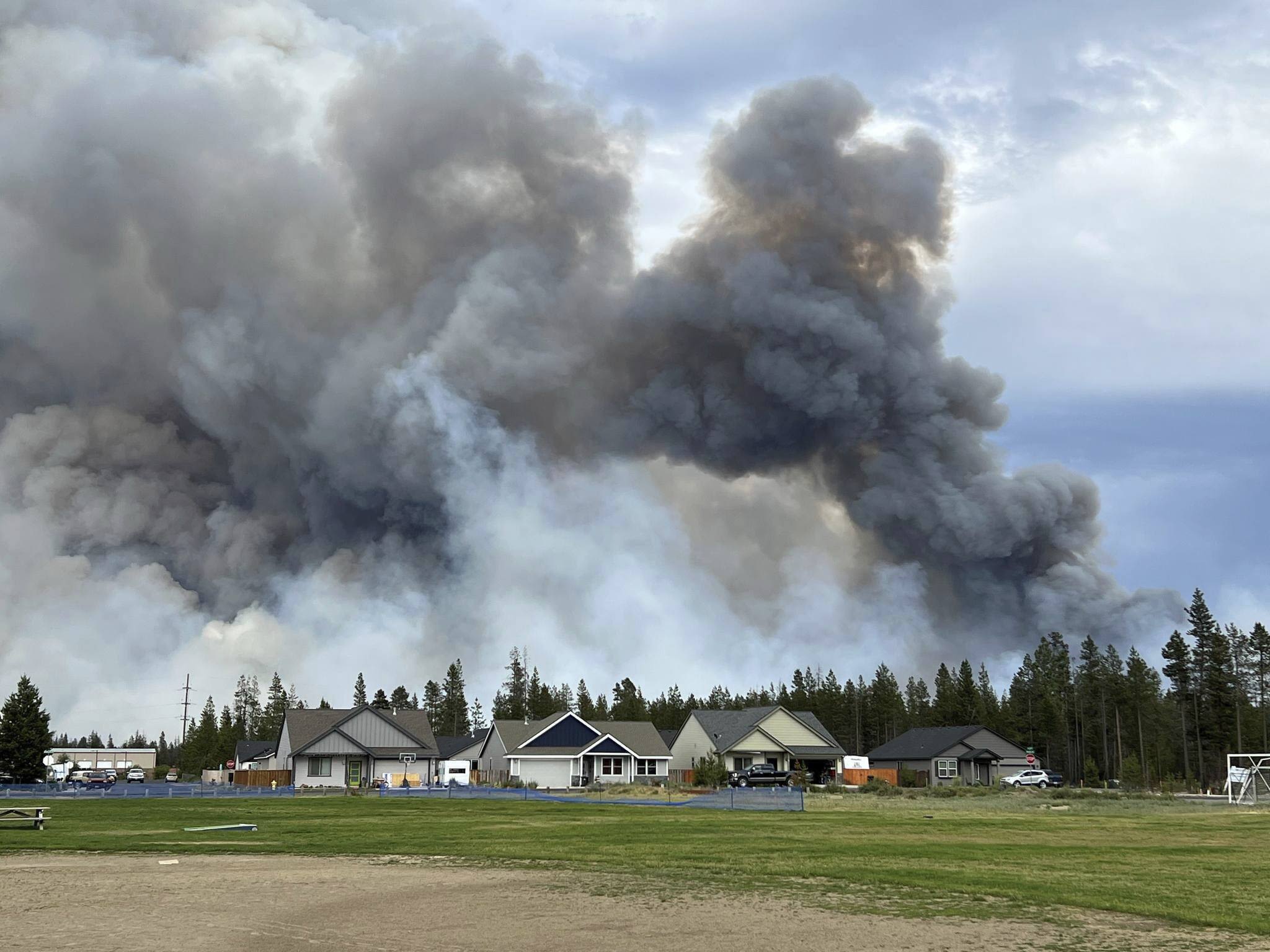 Wind-driven wildfire spreads near popular central Oregon vacation spot and prompts evacuations