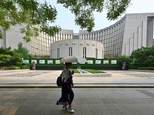 China central bank cuts two key rates to support flagging economy