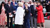 Veterans sing and dance at close of town commemoration service in Normandy