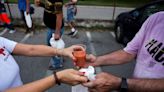 As Spain swelters, volunteers serve cold soup to homeless