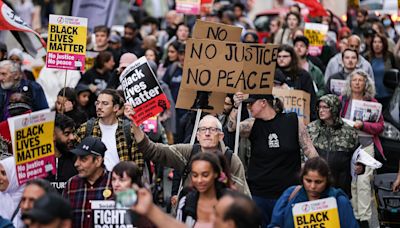 Protesters block roads and trams in Manchester after airport arrests