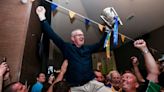 Clare manager Lohan carried aloft as he brings Liam MacCarthy Cup to home club