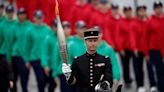 France's Bastille Day parade meets Olympic torch relay as political crisis continues