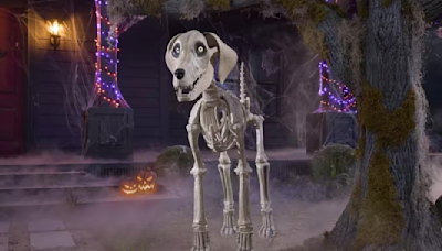 Skelly, Home Depot's 12-foot skeleton, gets a dog — and he's a very good boy