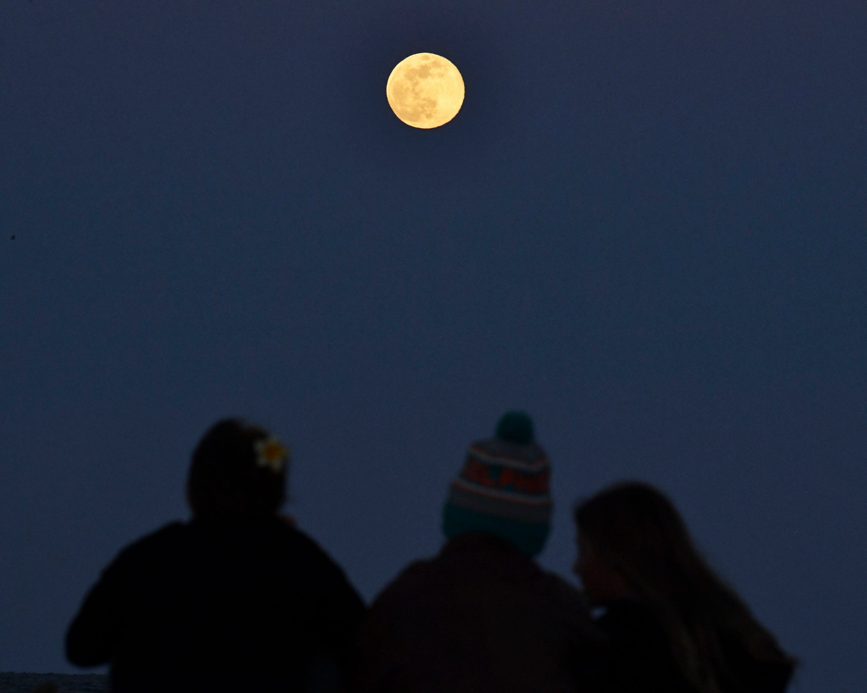 April's full pink moon rises Tuesday, April 23, as a sign of spring and looming summer heat