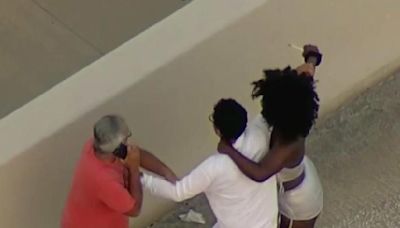 Caught on camera: Woman attacked two men after crash on MacArthur Causeway