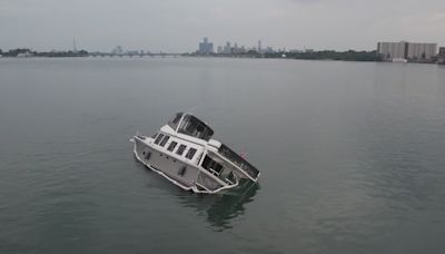 Half-sunken 54-foot boat stuck in Detroit River for days, 20 people rescued