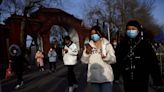 Don't press 'pandemic panic button' scientists caution on China pneumonia report