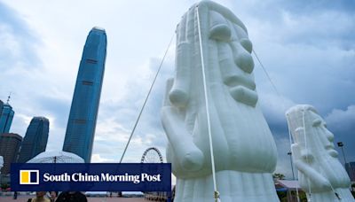 Inflatable replicas of world landmarks defended by Hong Kong art show organisers