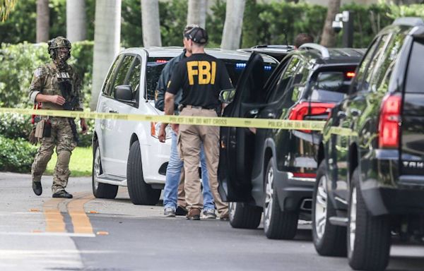 Medical examiner arrives at developer Sergio Pino’s street after FBI activity, loud bangs