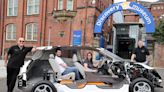 Electric car chopped in half squeezes through museum doors for new display