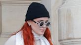 Bella Thorne Masters Sleek Monochromatic Style With White Chunky Sneakers in Paris