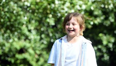 The face of a little girl who finally beat cancer and then met her friends in the park to party