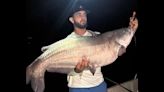 Fisherman using smaller net than usual lands state-record catfish