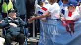 French children hail D-Day veterans as heroes as they arrive in Normandy for anniversary events