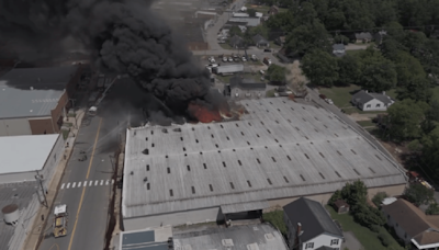 Person being treated for burns after crash causes large industrial fire in South Hill