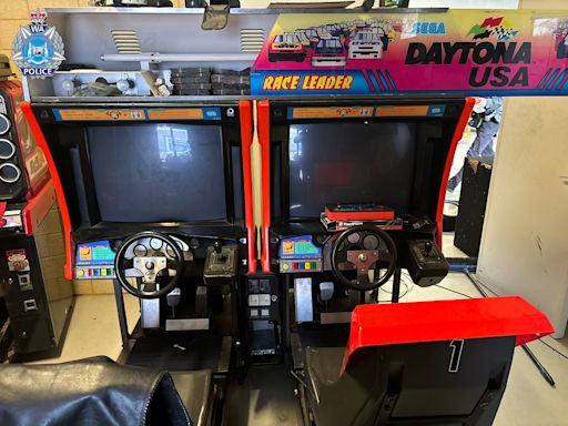 Rebels bikie charged after $400,000 found hidden in arcade game
