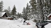 California ski resort workers tunnel their way into the office after getting 10 feet of snow