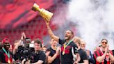 Leverkusen celebrate league and Cup titles with parade, stadium party