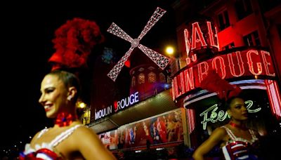 Paris’ famous Moulin Rouge windmill gets its blades back | CNN