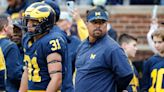 Michigan running backs coach Mike Hart carted off after collapsing on sidelines