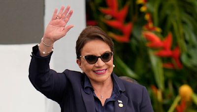 Honduras' president is asked to resign after corruption scandal she says is a plot to oust her