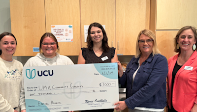 University Credit Union presents checks to University of Maine at Augusta campus food pantries