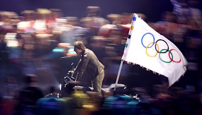 Tom Cruise's Olympics closing ceremony stunt took over 1 year to plan. Here’s how it came together.