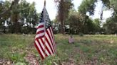 Church members put flags on graves of Black veterans at restored Jacksonville cemetery