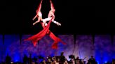 See acrobatics, aerial flyers and more above the Salina Symphony as it plays movie music