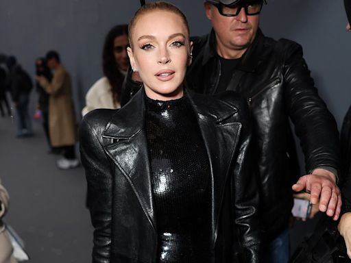 Lindsay Lohan poses up a storm in a black sequin dress at Balenciaga