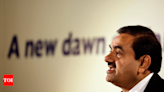 Adani amps up green energy bet to $100bn - Times of India