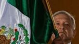 Mexican President Andres Manuel Lopez Obrador waves the national flag during Independence Day celebrations