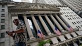 Wall Street and European markets slip after hawkish Powell speech